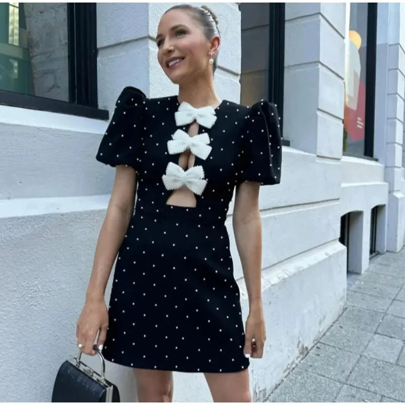 Dania - Bow embellished mini dress