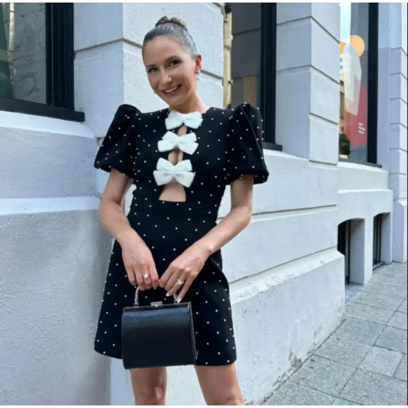 Dania - Bow embellished mini dress